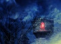 Old tower and spooky trees at night Royalty Free Stock Photo