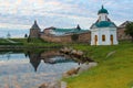 The old towers of the fortress are reflected in the lake. Reflection in the lake of the castle towers