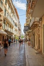Old town alley with tourists in Corfu town, Kerkyra, Greece