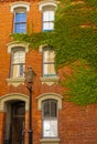 Old Town with beautiful architecture. Pedestrian exploring charm of old town. Houses of old historical neighborhood