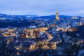 Old town of Bern in winter blue hour with snowy and illuminated buildings