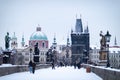Old Town Bridge Tower by the famous Charles Bridge. The city of Prague covered with snow
