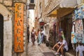 Old town in Budva. Ancient Romanesque houses, stone streets. Tourists. Shops and cafes. Montenegro, Balkans. Summer.
