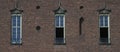 Old town building wall with three window