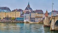 Old Town district with Martin`s Church and Mittlere Brucke, on April 1 in Basel, Switzerland