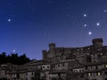 Old town dominated by castle at night