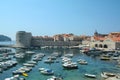 Old town of Dubrovnik with its old port full of boats, Croatia, seen from above with the Adriatic see in the background Royalty Free Stock Photo