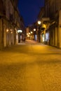 Old town in the evening blurred. Night scene with street illumination unfocused. Cityscape unfocused background. Royalty Free Stock Photo
