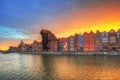 Old town of Gdansk with historic Port crane over Motlawa river at sunset, Poland Royalty Free Stock Photo