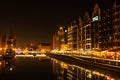 Old town in Gdansk at night. The riverside on Granary Island reflection in Moltawa River Cityscape at twilight. Ancient Royalty Free Stock Photo