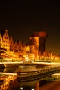 Old town in Gdansk at night. The riverside on Granary Island reflection in Moltawa River Cityscape at twilight. Ancient Royalty Free Stock Photo