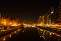 Old town in Gdansk at night. The riverside on Granary Island reflection in Moltawa River Cityscape at twilight. Ancient Royalty Free Stock Photo