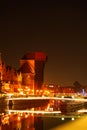 Old town in Gdansk at night. The riverside on Granary Island reflection in Moltawa River Cityscape at twilight. Ancient Royalty Free Stock Photo