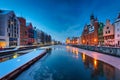 Old town of Gdansk over Motlawa river at snowy dawn. Poland