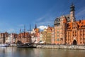 Old town of Gdansk with pirate sail ship reflected in Motlawa river, Poland