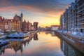 Old town of Gdansk reflected in the Motlawa river at sunrise, Poland. Royalty Free Stock Photo