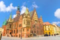 Old Town Hall gothic building with clock tower spire on cobblestone Rynek Market Square in old town historical city centre of Wroc Royalty Free Stock Photo