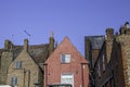 Old town house roof tops including red cement rendered building