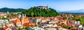 Old town and the medieval Ljubljana castle on top of a forest hill in Ljubljana, Slovenia Royalty Free Stock Photo