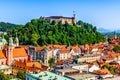 Old town and the medieval Ljubljana castle on top of a forest hill in Ljubljana, Slovenia Royalty Free Stock Photo