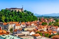 Old town and the medieval Ljubljana castle on top of a forest hill in Ljubljana, Slovenia Royalty Free Stock Photo