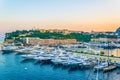 Old town of Monaco overlooking port Hercule during sunset