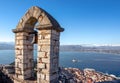 Old town of Nafplion in Greece view from bell tower, with tiled roofs, small port and bourtzi castle on the Mediterranean sea. Royalty Free Stock Photo