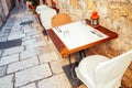 Old town narrow alley with restaurant tables and chairs in Split, Croatia Royalty Free Stock Photo