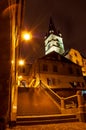 Old town narrow passage with stairs and a clock tower Royalty Free Stock Photo