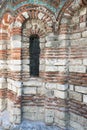 Old Town of Nesebar. Church of St. Paraskeva, XIII century. Stone facade of the church. Ceramic