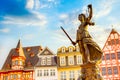 Old town square Romerberg with Justitia statue in Frankfurt Main, Germany with blue sky Royalty Free Stock Photo