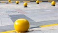 Old town street road brick background and yellow granite ball. Royalty Free Stock Photo