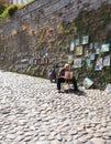 Old town Tallinn, Estonia - Street artist painting a picture for tourists Royalty Free Stock Photo