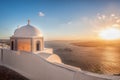 Old Town of Thira on the island Santorini, white church against colorful sunset in Greece Royalty Free Stock Photo