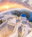 Old Town of Thira on the island Santorini, white church against colorful sunset in Greece Royalty Free Stock Photo