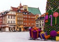 Old town of Warsaw with medieval houses, christmas tree, gifts. Royalty Free Stock Photo