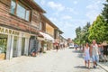 Old town with wooden medieval houses, tourists and souvenir shops in Nessebar Bulgaria