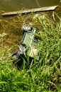 Old toy car dumped in the pond Royalty Free Stock Photo