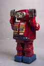 Old toy from the 1950s of a lonely and paradi robot made of red tin, battery operated