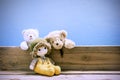 Old toy and Teddy bear on old wood in front blue background . Royalty Free Stock Photo