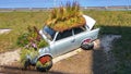 Old Trabant car parked planted many colorful flowers Royalty Free Stock Photo