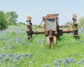 Rural Scene In Texas With Old Tractor And Bluebonnet Blossom In Springtime