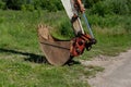 Old tractor bucket on the grass Royalty Free Stock Photo