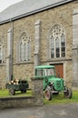 Old tractor and church, ardennes Royalty Free Stock Photo