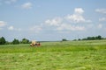 Old tractor cut grass summer day country landscape Royalty Free Stock Photo