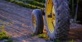 Old Tractor in Farm Field with Growing Crops Sunlight Royalty Free Stock Photo