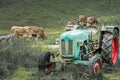 Old tractor on meadow. Beautiful mountain view in the Alps Royalty Free Stock Photo