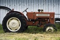 Old Tractor, Parked by the Barn Royalty Free Stock Photo
