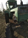 old tractor parked near the road close-up