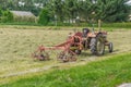 Old tractor with plow in the fields Royalty Free Stock Photo